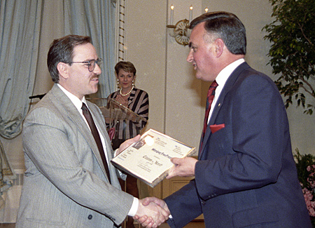 John Suillivan accepts Citation of Merit from Governor General Ray Hnatyshyn.