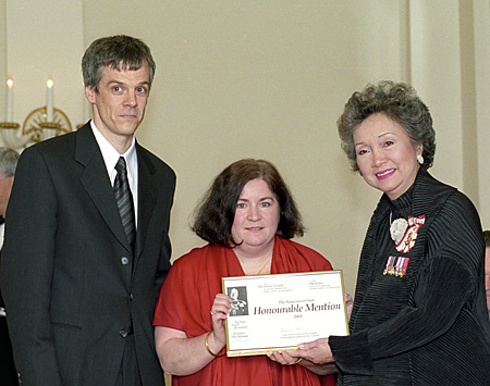 Reporters Lindsay Kines and Kim Bolan accept the 2001 Michener Honourable Mention award from Governor General Adrienne Clarkson.