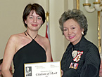 Reporter Leah Hendry accepts the 2001 Michener Citation of Merit from Governor General Adrienne Clarkson.