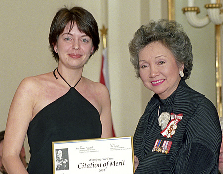 Reporter Leah Hendry accepts the 2001 Michener Citation of Merit from Governor General Adrienne Clarkson.