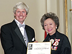Reporter Terence McKenna accepts the 2001 Michener Citation of Merit from Governor General Adrienne Clarkson.