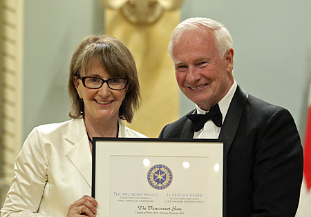 Patricia Graham accepts Citation of Merit from Governor General David Johnston.