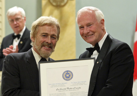 Pierre Sorman accepts Citation of Merit from Governor General David Johnston.