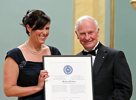 Melanie Coulson accepts the 2012 Michener-Deacon Fellowship for Journalism Education from Governor General David Johnston.