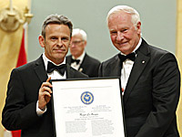 Roger LeMoyne receives Michener-Deacon Fellowship from Governor General David Johnston.