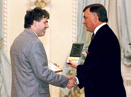 Reporter Tom Barrett, representing the Edmonton Journal, accepts the 1992 Michener Award for meritorious public service journalism from His Excellency, Raymon Hnatyshyn, Governor General of Canada.