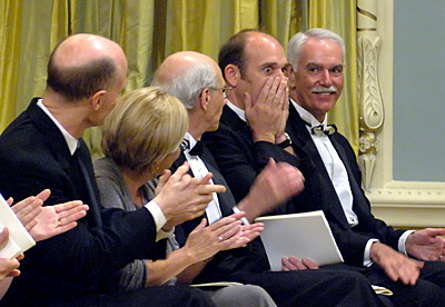 Citizen reporter Gordon Hoekstra reacts to the announcement of the winning entry. Curtis Barlow, deputy secretary (Policy, Program and Protocol) to the Governor General, looks on