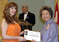 Her Excellency Adrienne Clarkson presents a Citation of Merit to reporter Moira Welsh representing the Toronto Star.