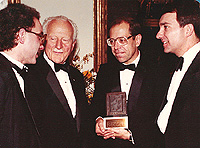 From left; Kitchener-Waterloo Record reporters Philip Jalsevac, Jim Romahn (holding Michener Trophy), and Paul Motz, Record President and General Manager, with former Governor General Roland Michener (second left). 