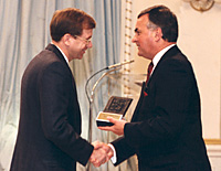 Bob Verdun, Editor and Co-owner of the Elmira Independent, accepts the 1990 Michener Award from His Excellency, the Right Honourable Ray Hnatyshyn